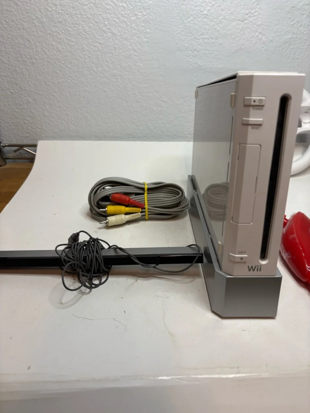 Nintendo White Wii Console with Red Remotes and Wheel